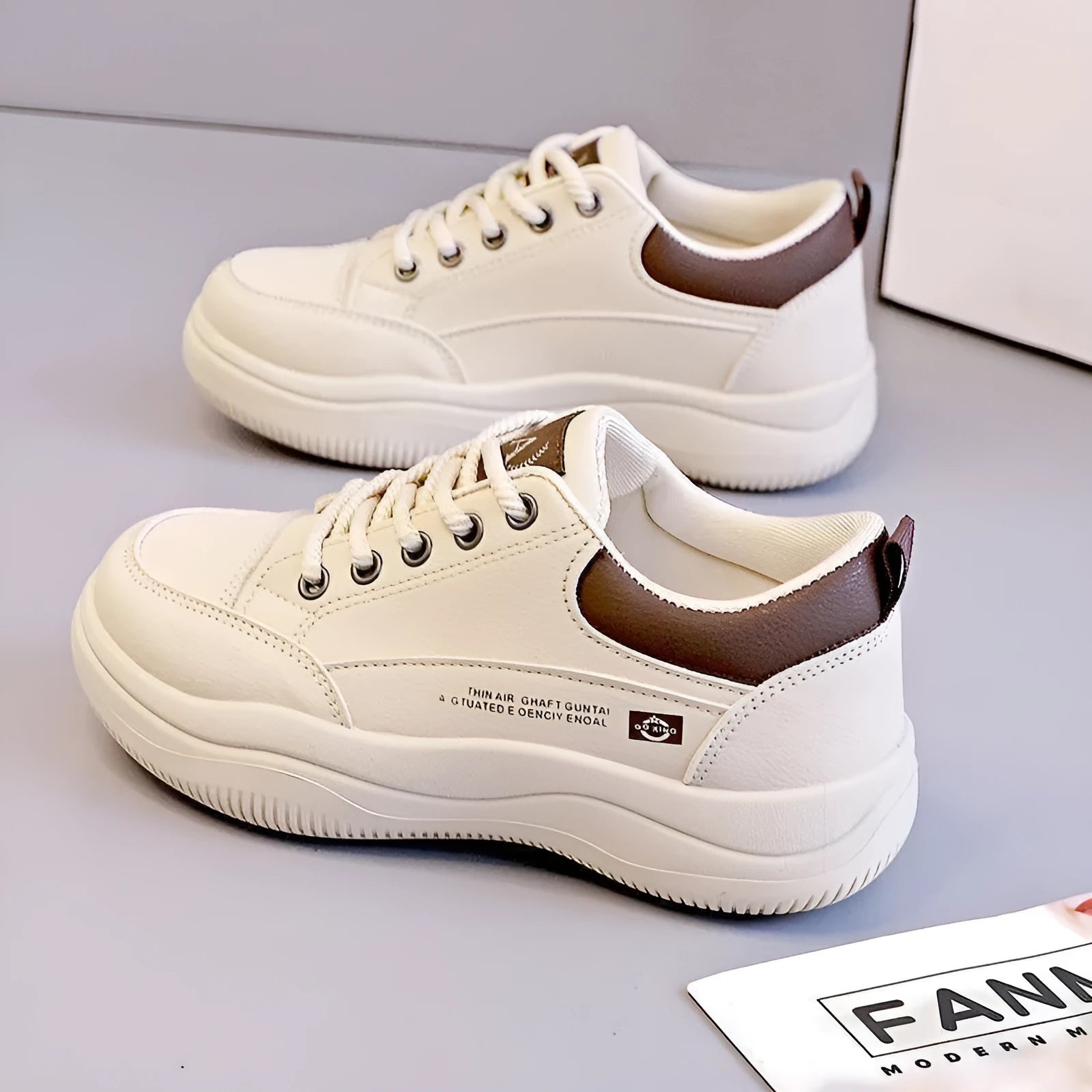 Women's white Korean-style leather pumps with cross straps and a flat mid-height heel.