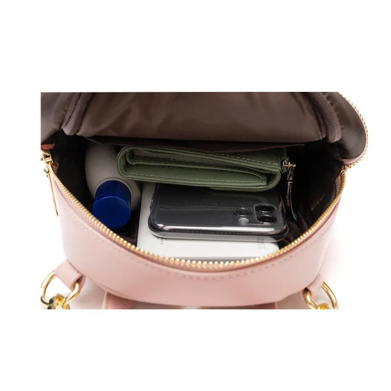 Soft PU mini backpack in street style with three-dimensional pocket and contrast trim