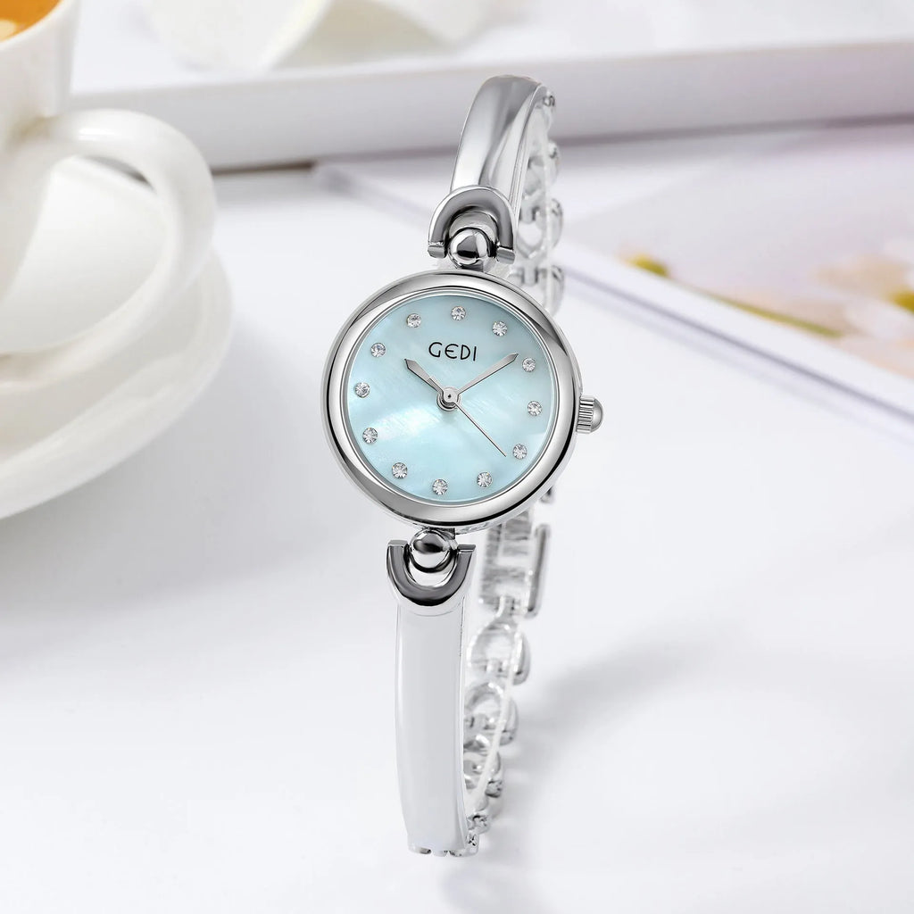 Silver case women's bangle watch with round dial and white plate silver stripe