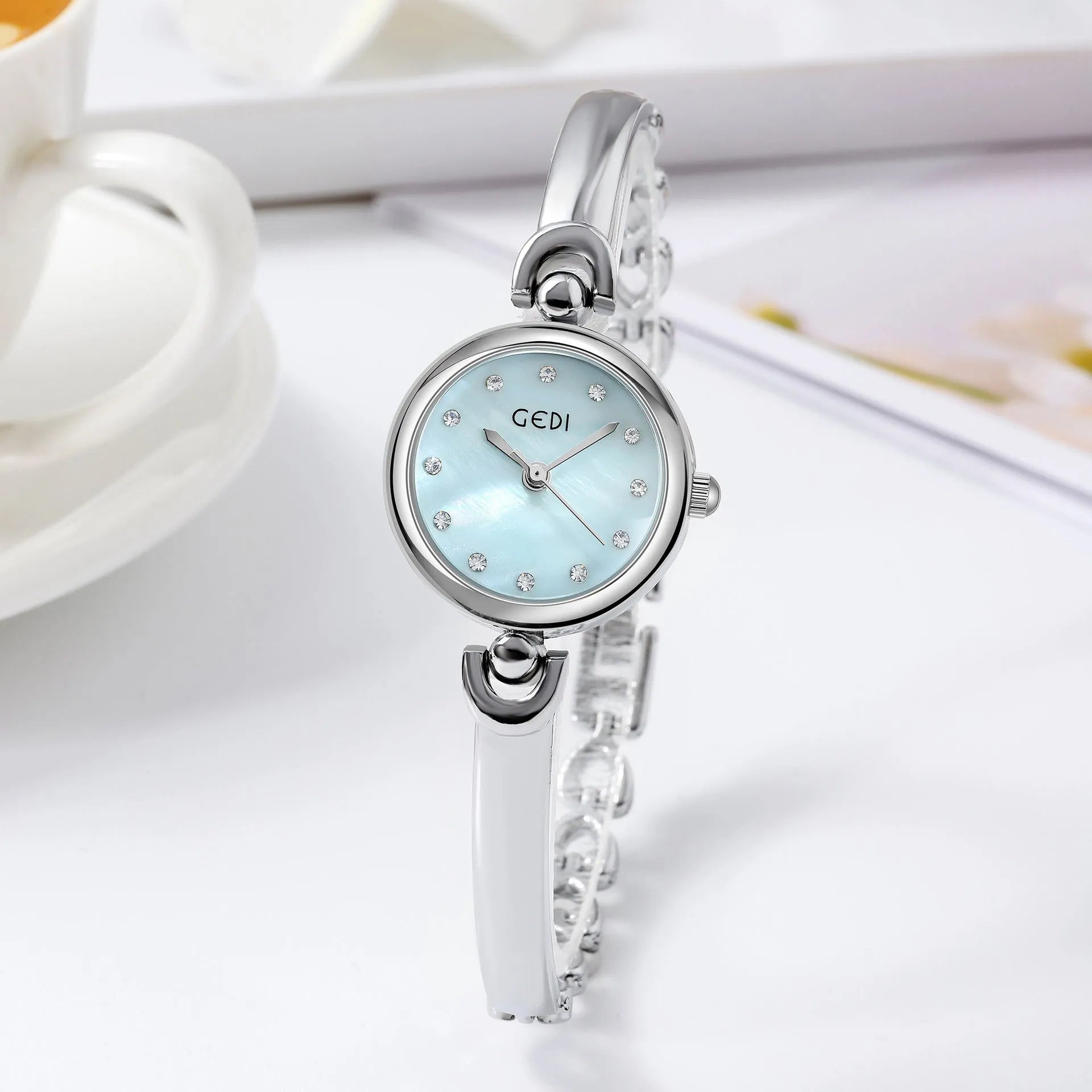 Silver case women's bangle watch with round dial and white plate silver stripe