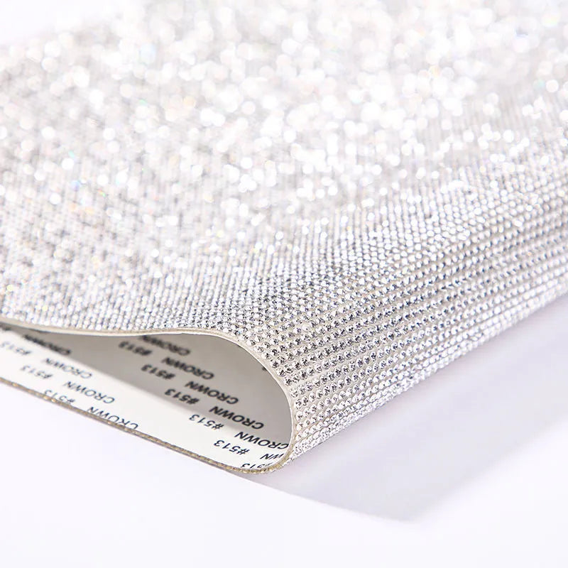 Rhinestone sticker sheet with hot drill glue backing showing eight-eye pattern stones in multiple colours