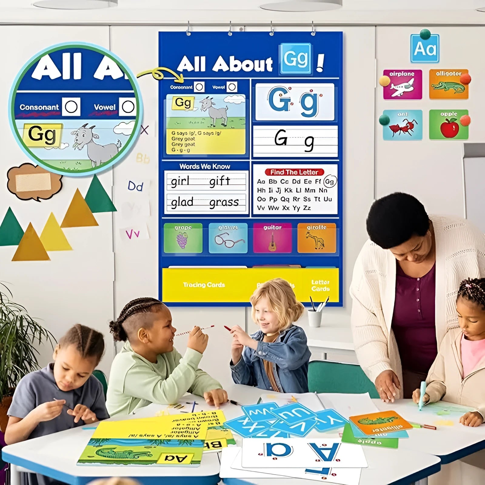 Alphabet learning sleeve chart with word cards, letter cards, and picture cards laid out for play.