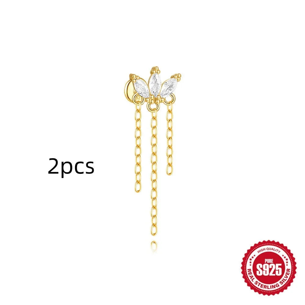 Geometric kite-shaped sterling silver earrings with a gold electroplated chain tassel featuring rhinestones.