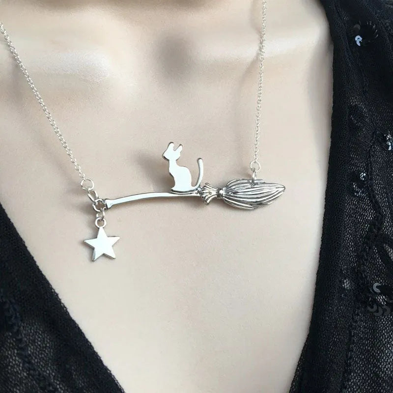 Alloy necklace with a simple black cat pendant for Halloween, shown in silver and gold colour options.