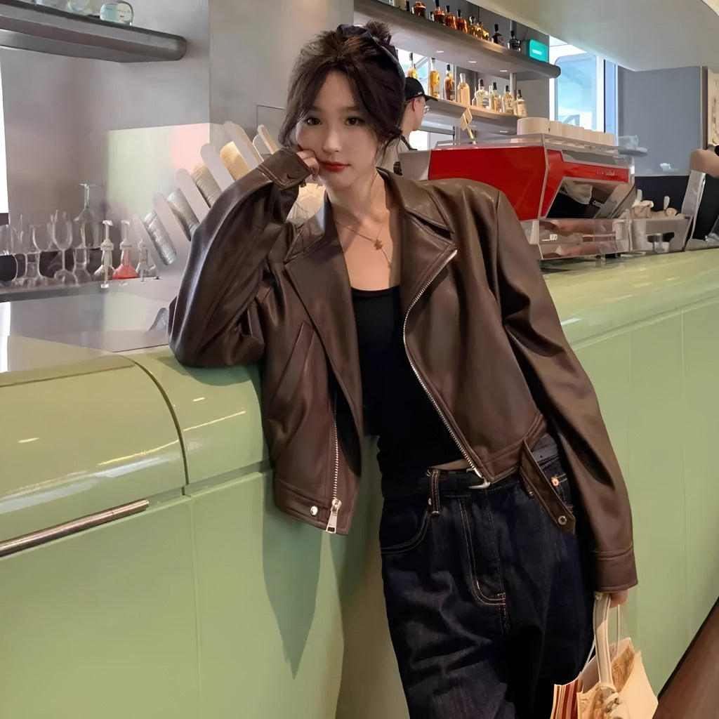 Brown women's retro slim-fit leather coat jacket with long sleeves and pockets.