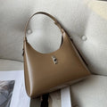 Genuine leather dumpling-shaped crossbody shoulder bag in apricot colour with a front sandwich pocket.