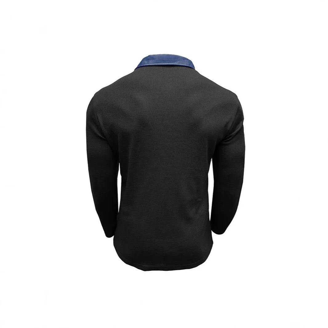 Man modelling a long-sleeved waffle-texture polo shirt in a loose, retro style.