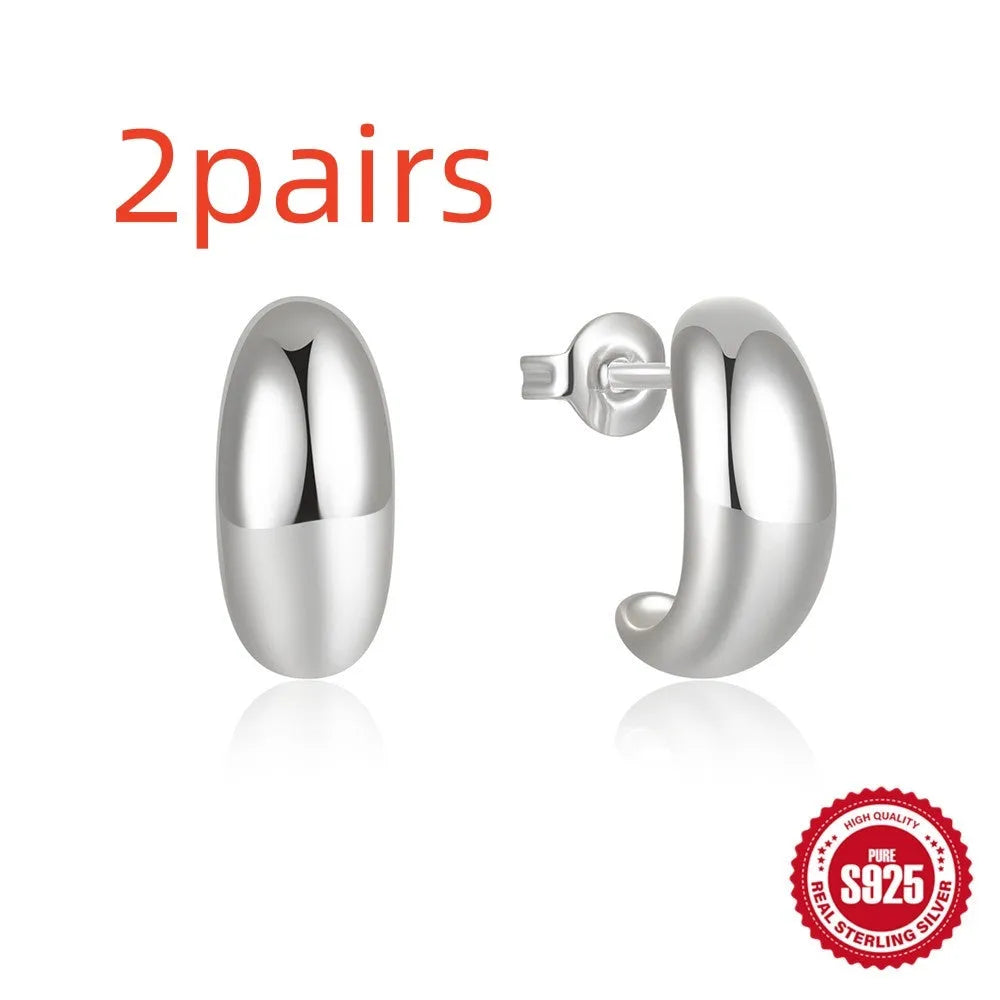 Geometric C-shaped sterling silver stud earrings with gold electroplated finish