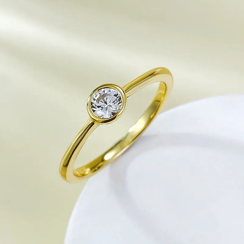 Minimalist crown-shaped silver ring with linear details, shown in gold and platinum electroplated finishes.