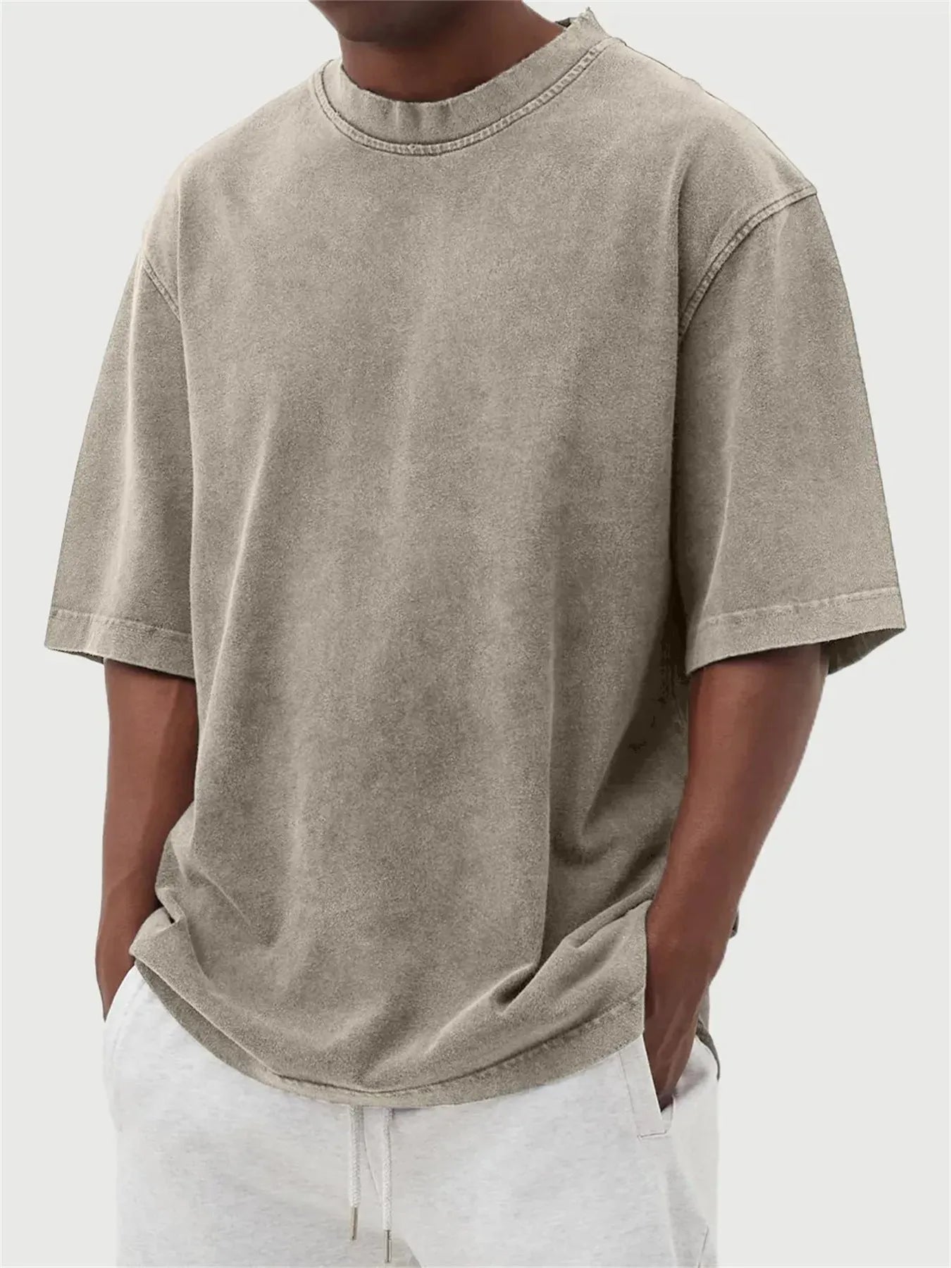 Men's washed distressed pullover t-shirt in solid colour with loose fit and stone washed finish