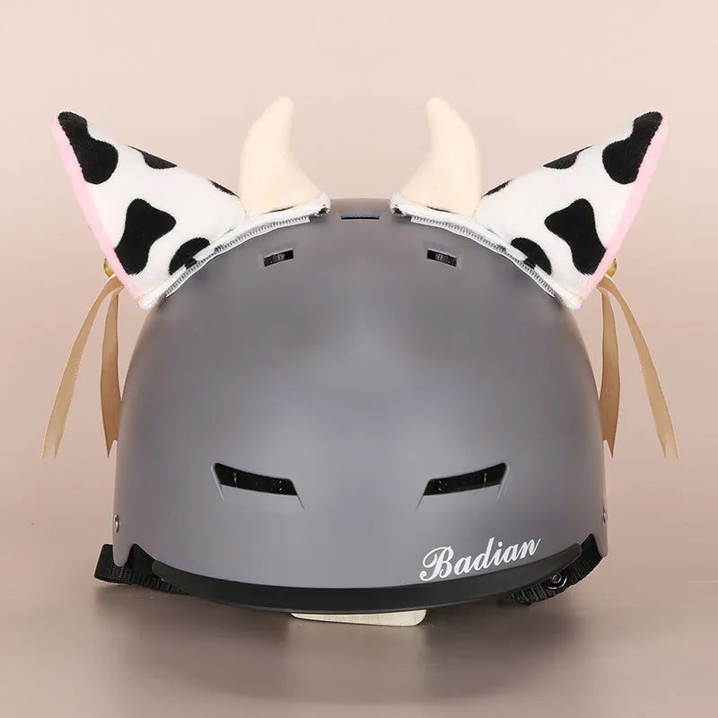 Cartoon-themed plush fabric helmet cover and ear decorations set for motorcycles and bicycles.