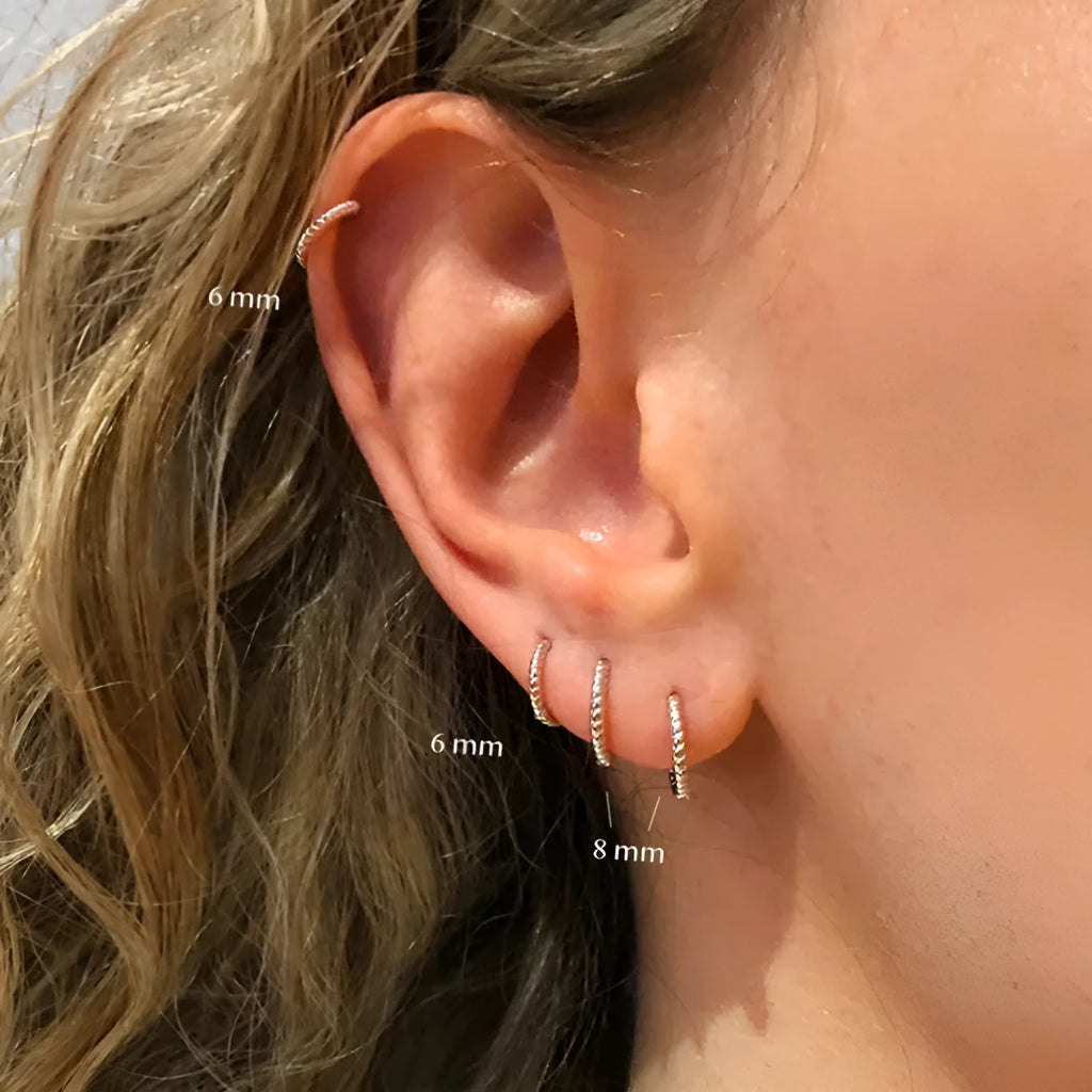 Sterling silver twisted ring earrings in geometric round design with gold or platinum finish
