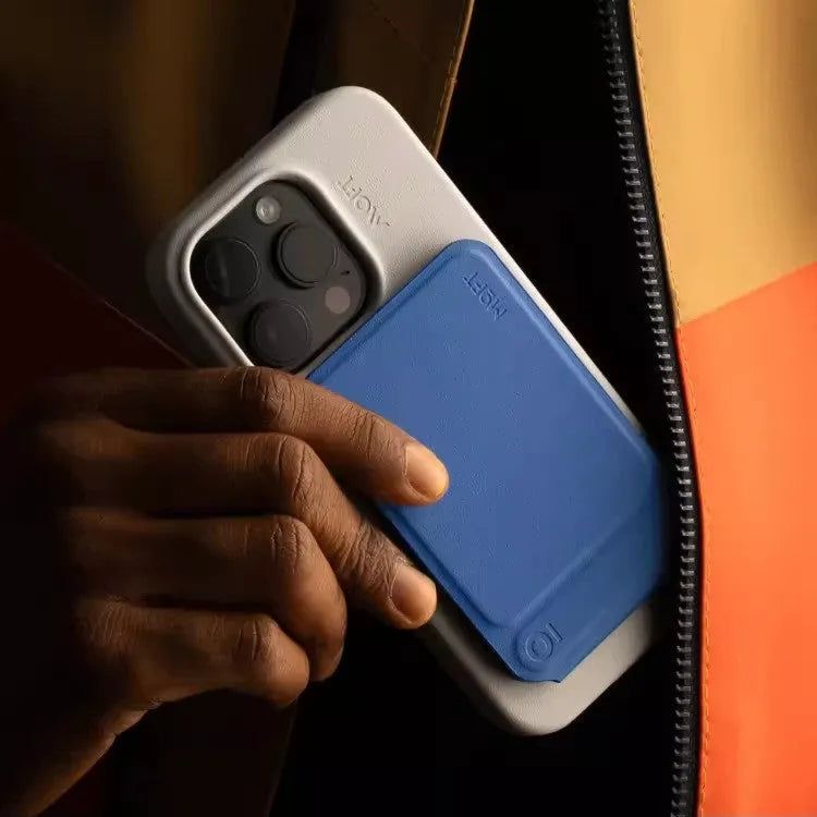 Black magnetic mobile phone case with integrated kickstand deployed, showing slim profile and leather finish.