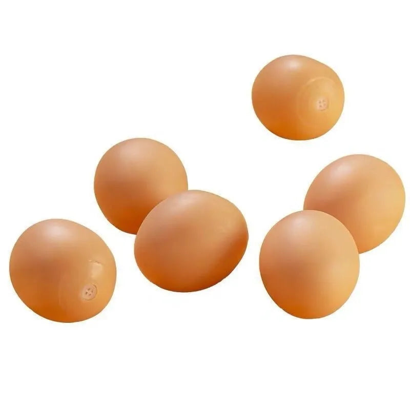 Green durable rubber dog chew ball toy with sound simulation egg inside for teeth cleaning.