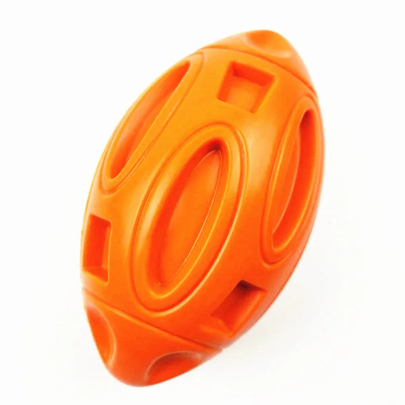Blue, green, and orange rubber squeaky dog chew ball with grooved surface for medium and large breeds.