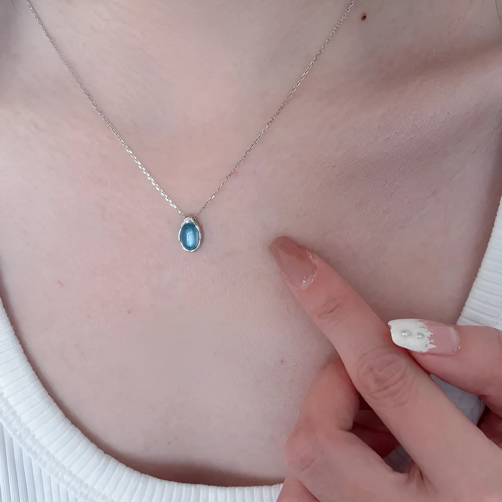 Women's navy blue water drop necklace with geometric pendant on adjustable copper chain