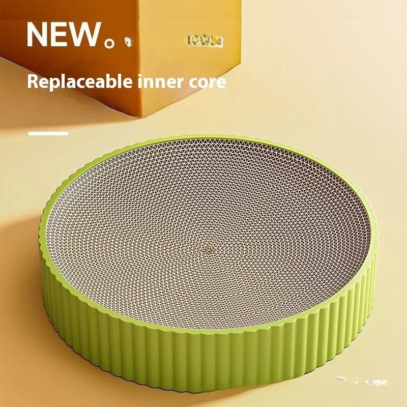 Green and white round cat scratching board with corrugated paper centre measuring 55 cm diameter
