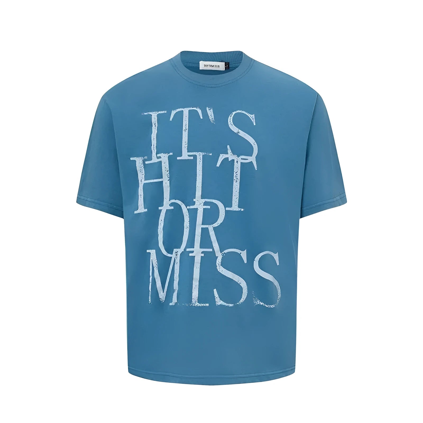 Man wearing a blue loose-fit T-shirt with a large white American retro style letter print on the front.