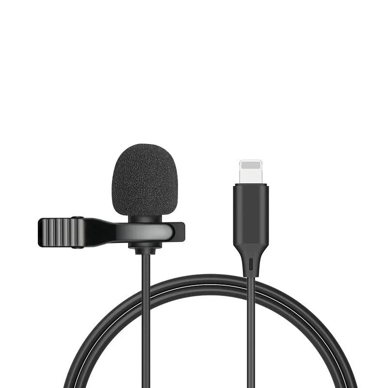 White lavalier lapel clip microphone with long cable and in-ear earpieces next to an iPhone.
