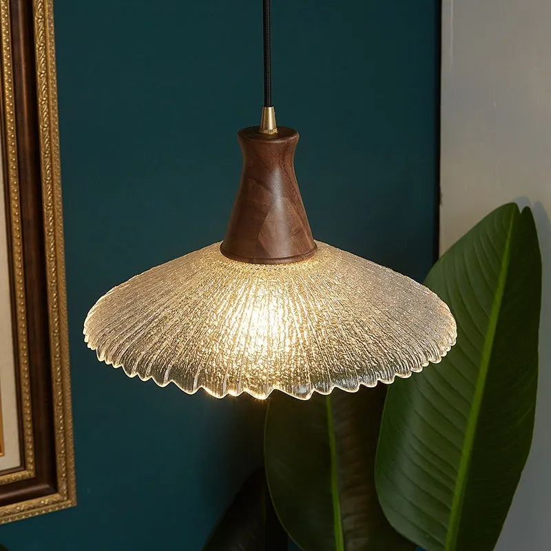 Retro-style brass and glass chandelier with wood body for ceiling mounting in restaurants.