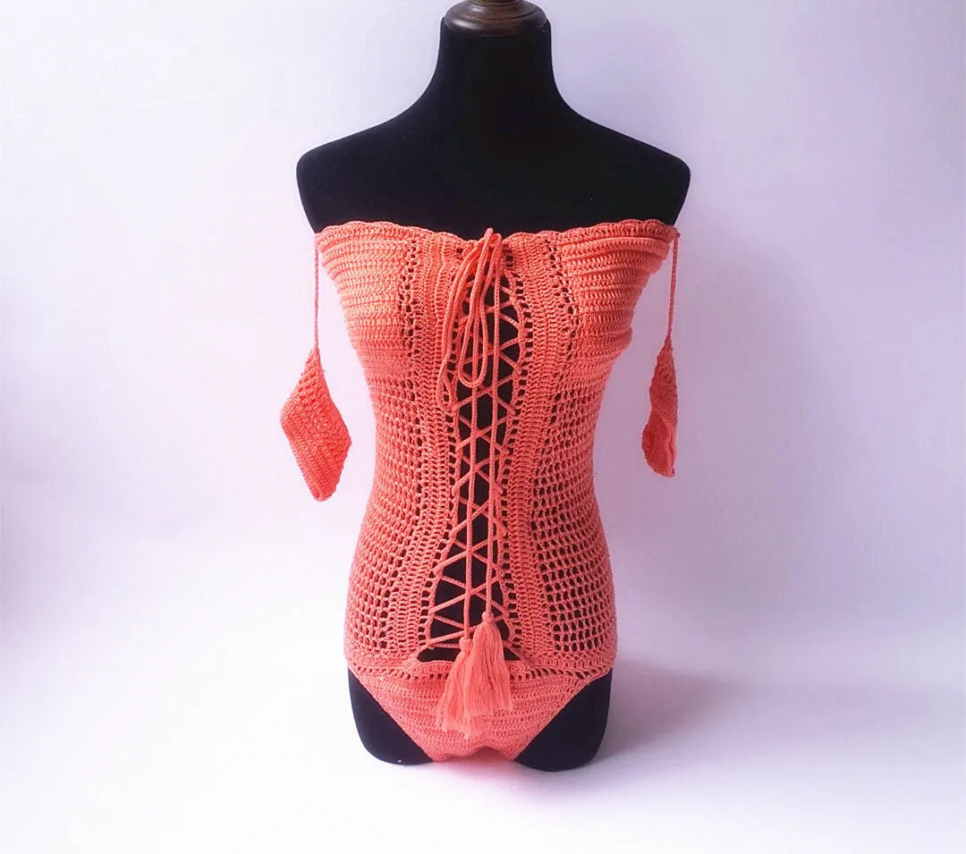 Women's white off-the-shoulder one-piece swimsuit on a mannequin, showing the neckline design.