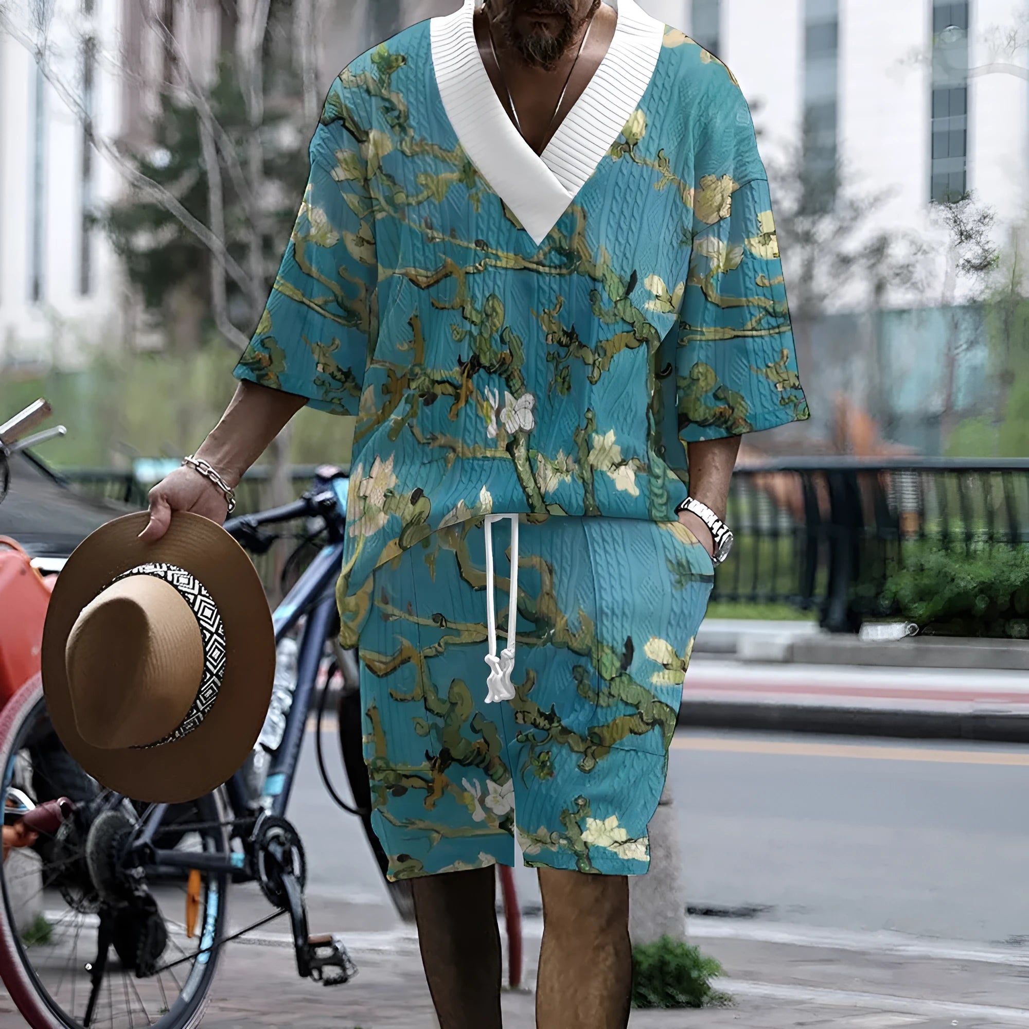 Men's peacock blue knitted casual suit set with 3D print design, showing T-shirt and mid-length shorts.