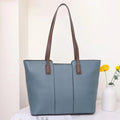 Genuine leather women's large shoulder bag in box-type design with sandwich pocket.