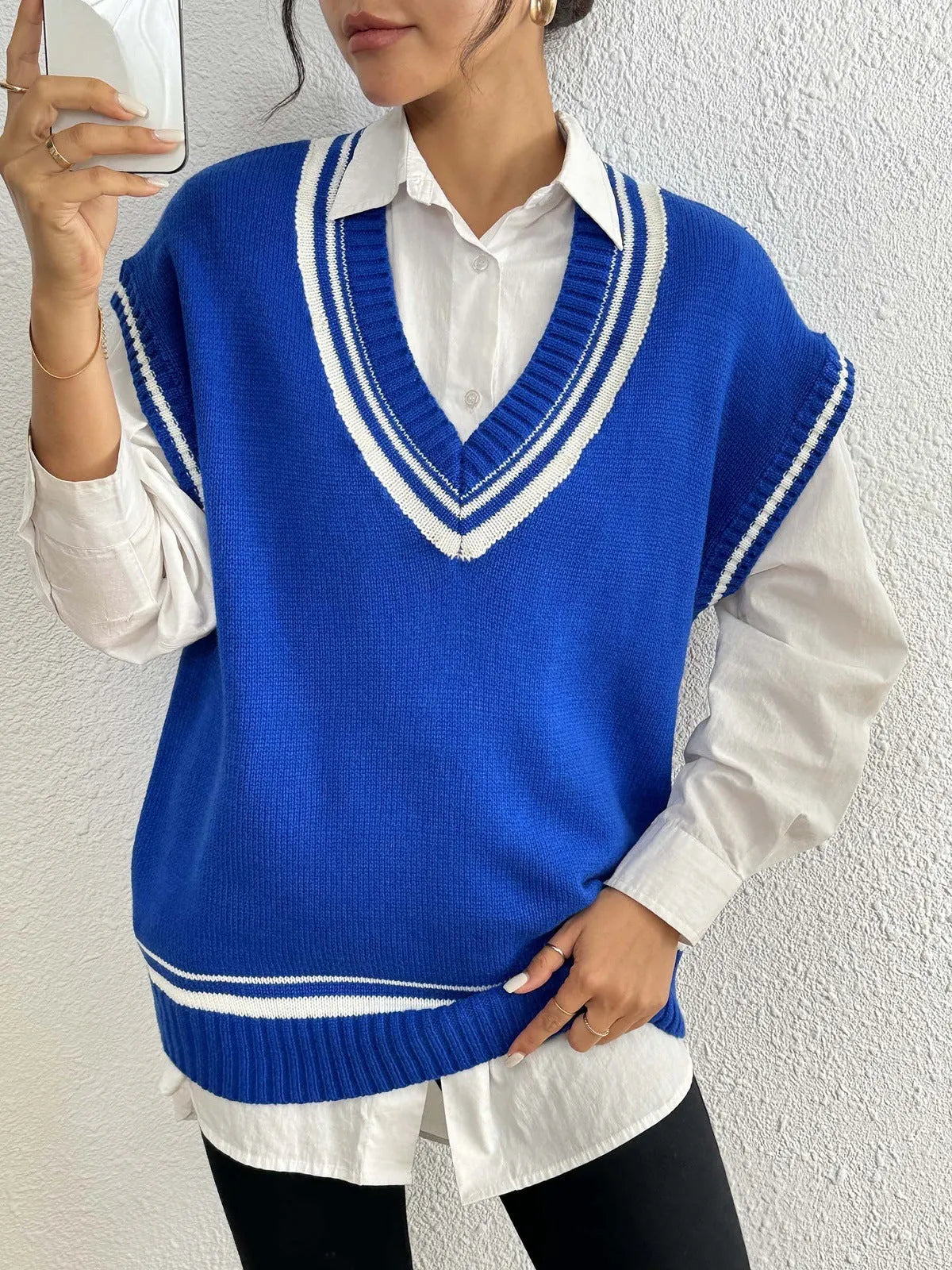 Women's loose fit college style vest sweater in blue, coffee, or black colour.