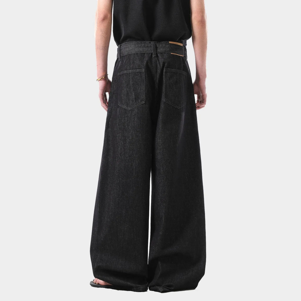 Black gold high-waist straight-leg jeans with zip fly on mannequin