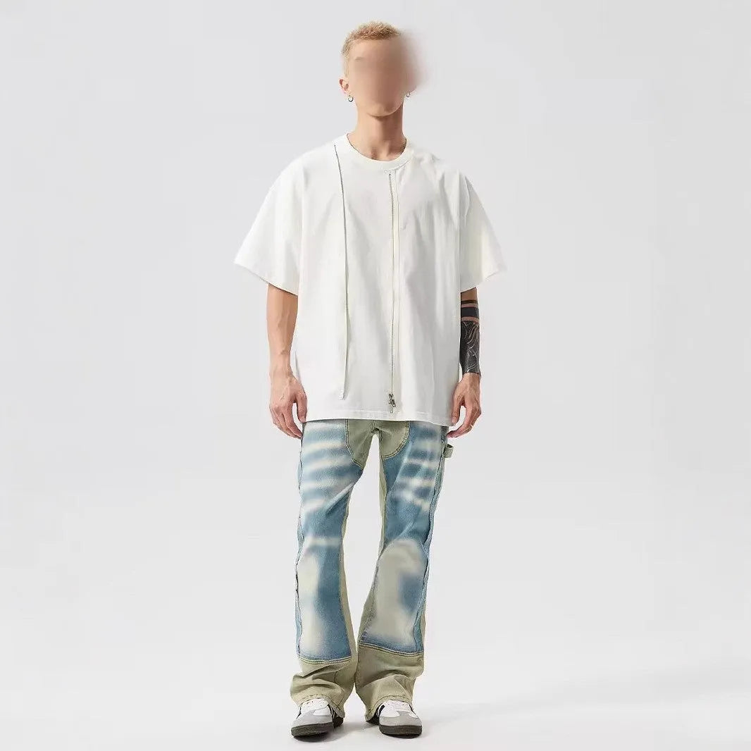 Yellow and blue retro patchwork distressed jeans on a model