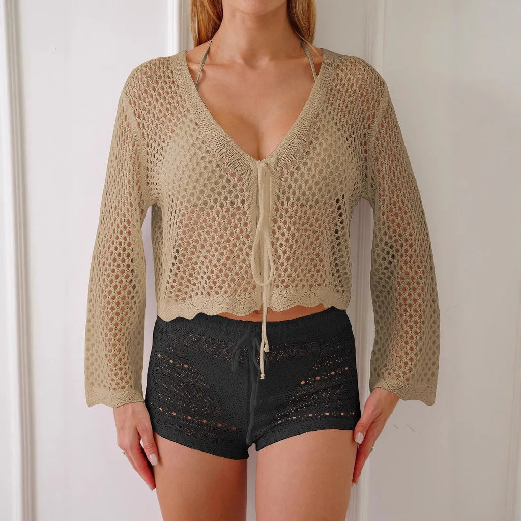 Short length women's cardigan blouse with bell sleeves in a choice of colours.