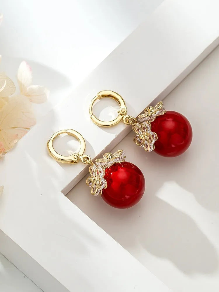 Geometric rose detail zircon earrings for women in copper, available in multiple colours.