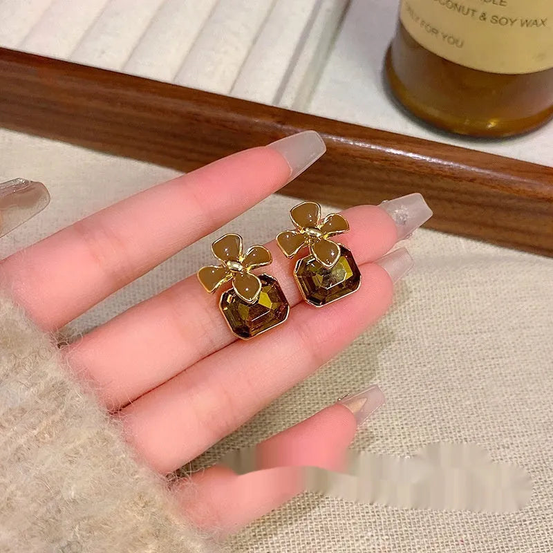 Gold electroplated alloy flower earrings with coffee colour floral motif for women
