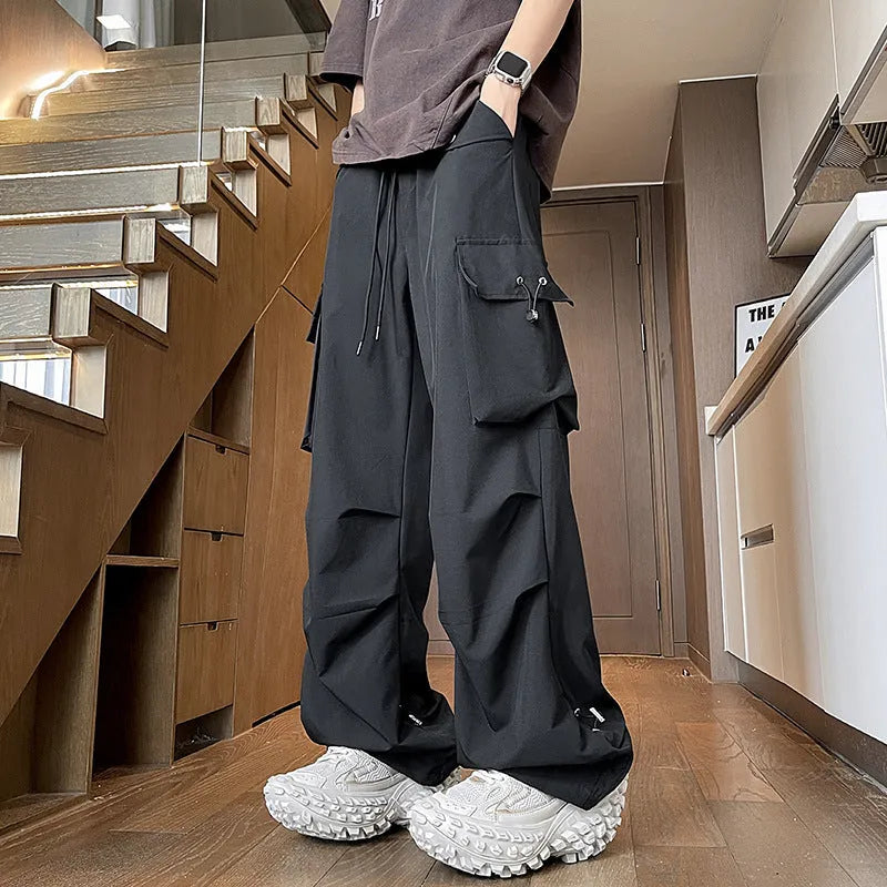 Waterproof loose straight-leg trousers in plus sizes, shown in black, grey, and white.