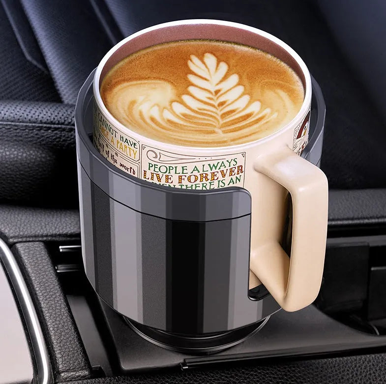 Matte black car cup holder expander with adjustable base for large bottles and travel mugs.