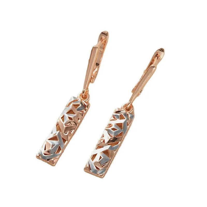 A pair of rectangular hollow geometric stud earrings with a two-tone colour finish on alloy posts.