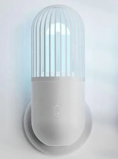 Portable capsule ultraviolet disinfection lamp in black, brown, green or white with display showing 52x52x136mm dimensions