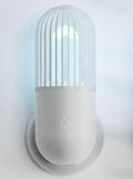 Portable capsule ultraviolet disinfection lamp in black, brown, green or white with display showing 52x52x136mm dimensions