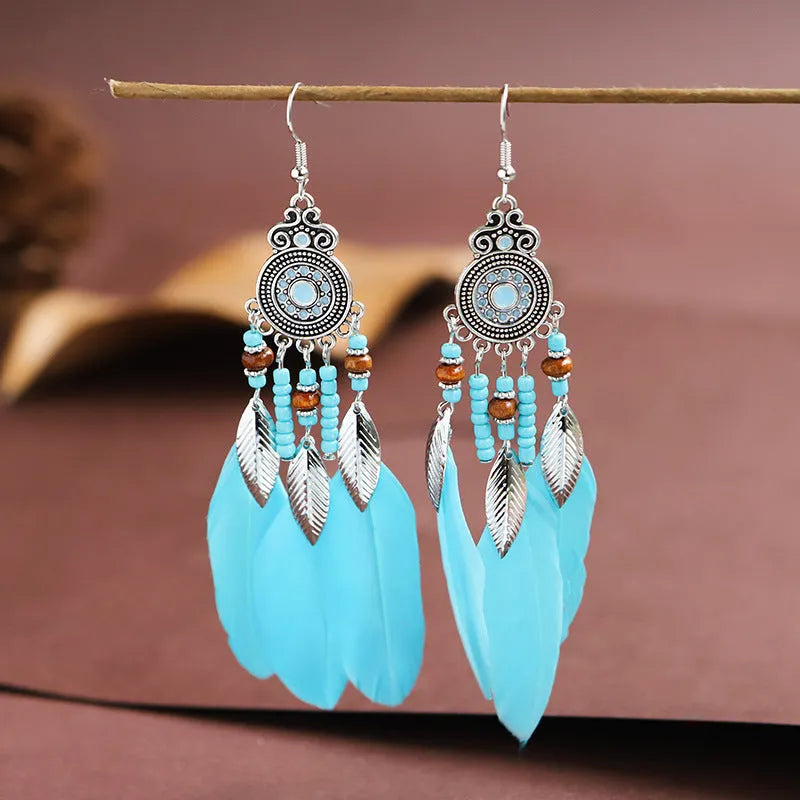 Round drop feather earrings with leaf detailing in various bohemian colours