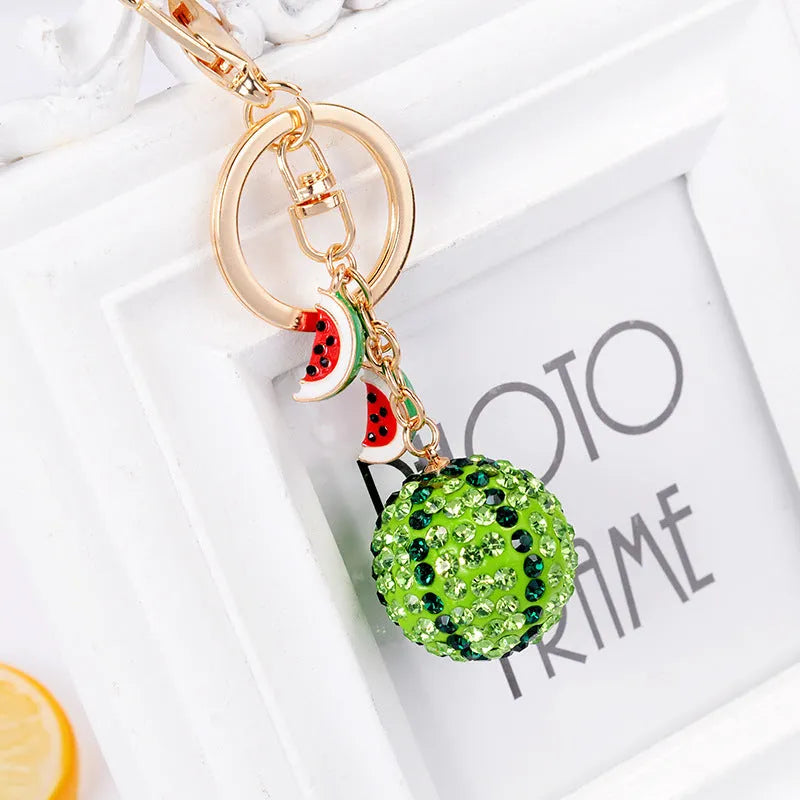 Green watermelon shaped zinc alloy keychain measuring 12cm