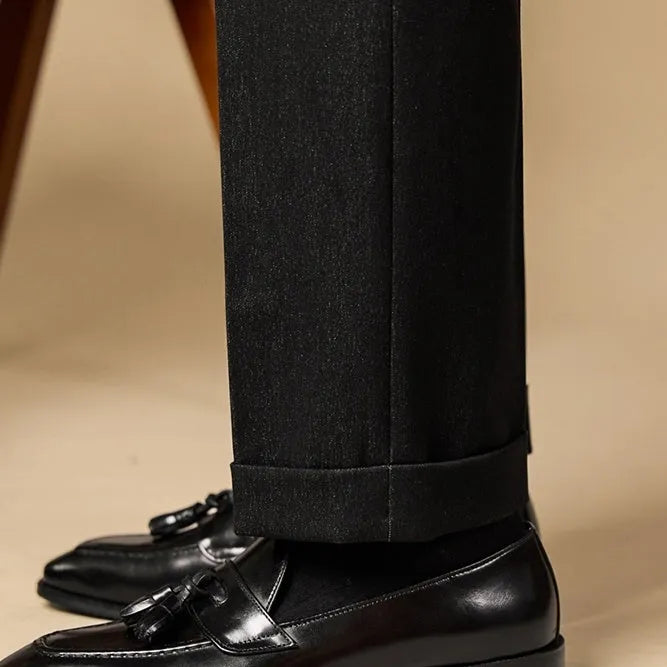 Men's black genuine leather tassel loafers with a rubber sole
