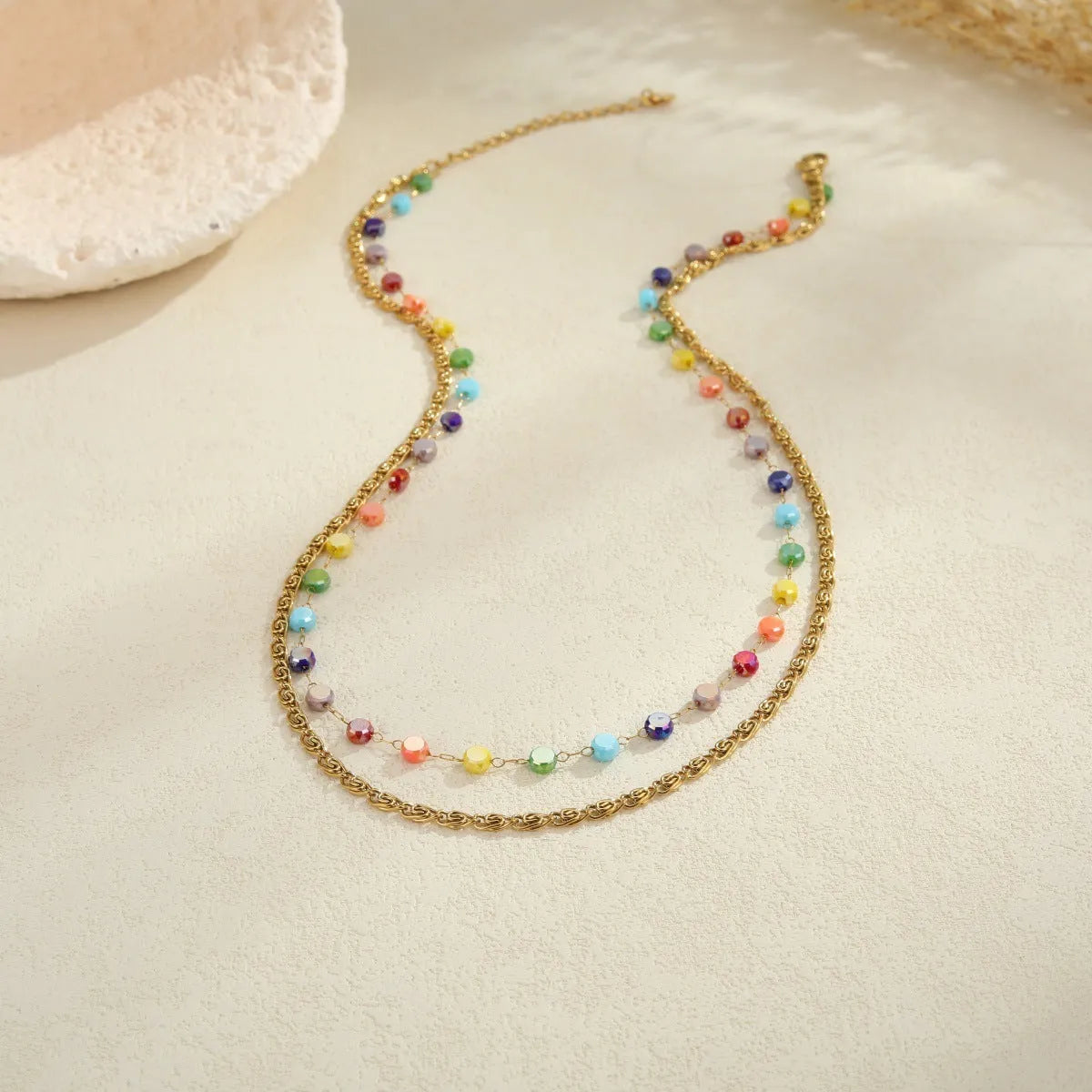 Colorful beaded stainless steel gold-plated double layer clavicle necklace for women on white background