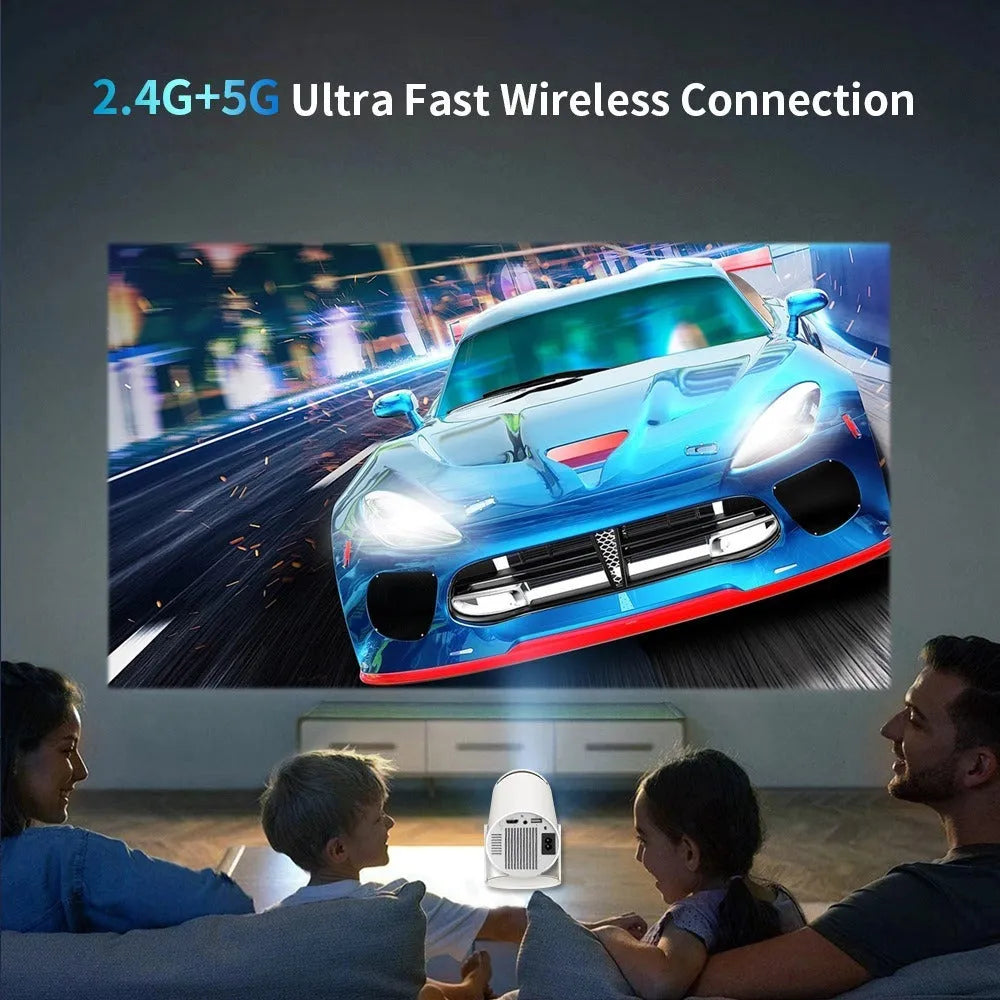 White X10 PLUS portable smart wall projection game machine with remote control and gamepad on dark surface
