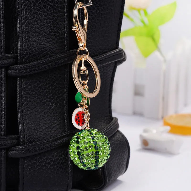 Green watermelon shaped zinc alloy keychain measuring 12cm