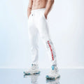 Men's ankle-tied sweatpants in polyester-spandex blend with fleece-lined colour options