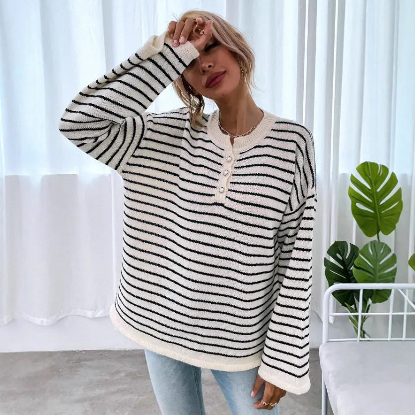 Black striped women's loose top with drop shoulders and button detail on viscose knit fabric