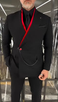 Black double-layered jacket with red inner lining and front chain detail on flat background