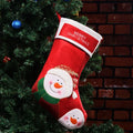Non-woven fabric Christmas stocking ornament with elk, elderly man, and snowman folk art designs.