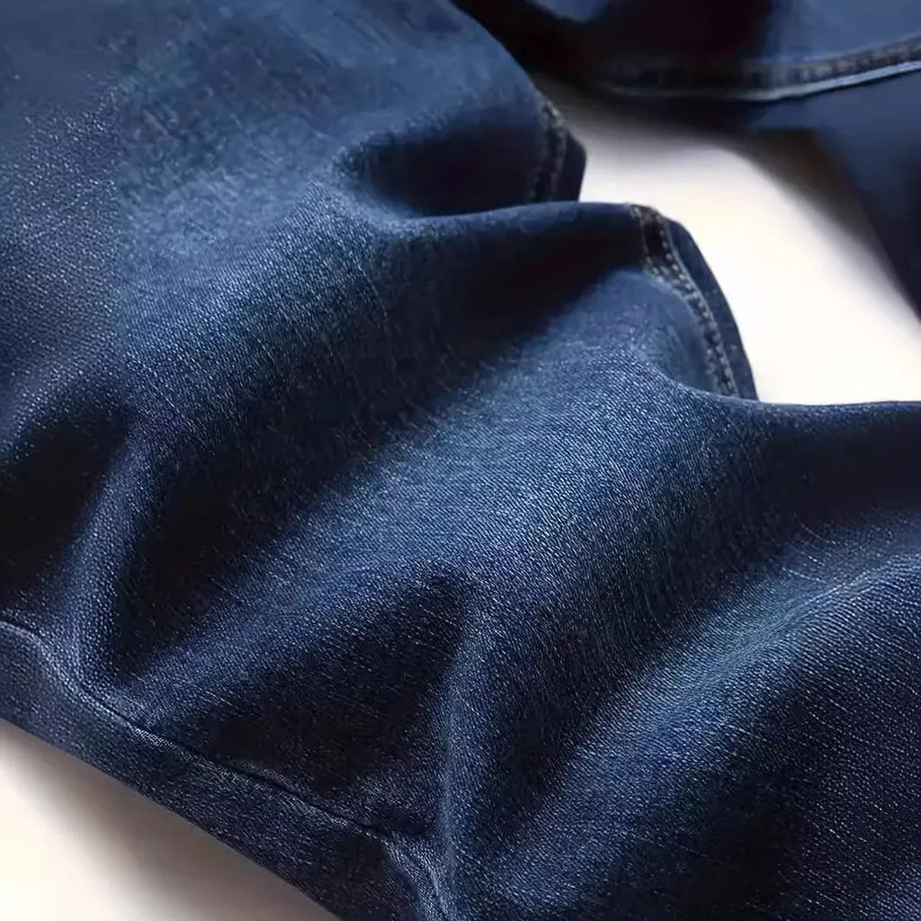 Men's dark blue slim casual jeans with skinny leg style and mid-waist cut