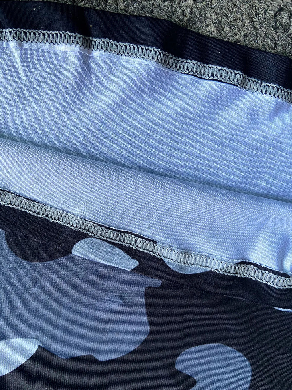 Men's grey long sleeve fishing shirt with mesh side panels and a crew neck.